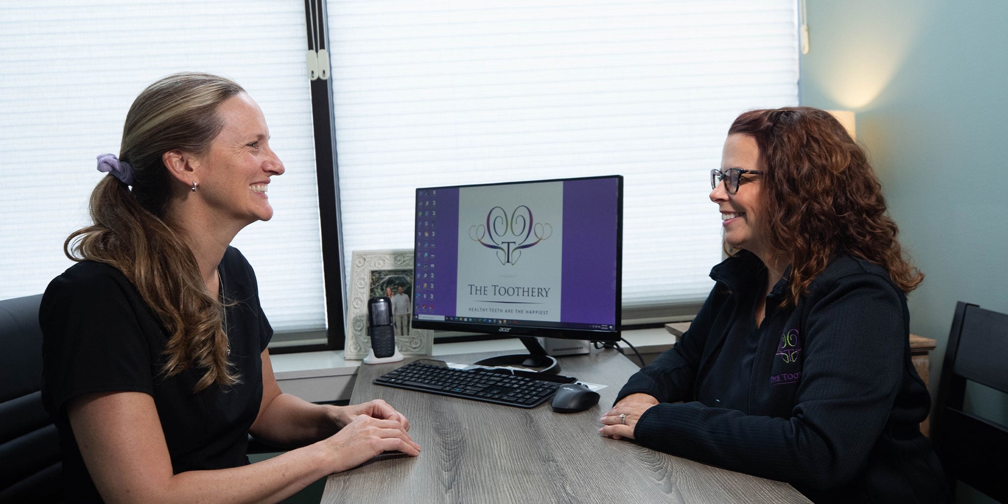 patient and staff member having a consultation for dental patients treatment