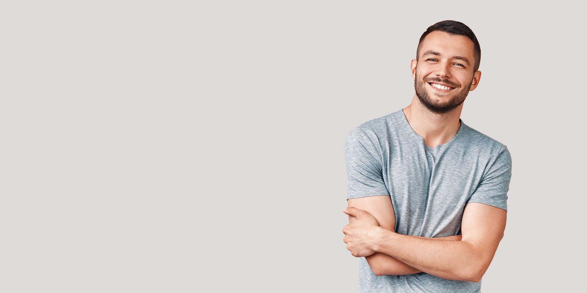 handsome veneer patient smiling brightly for their photo shoot